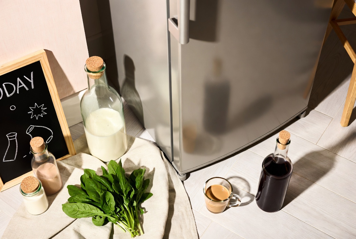 Cozy aesthetic kitchen refrigerator flat lay with fresh produce, linen and organized home elements in soft tones
