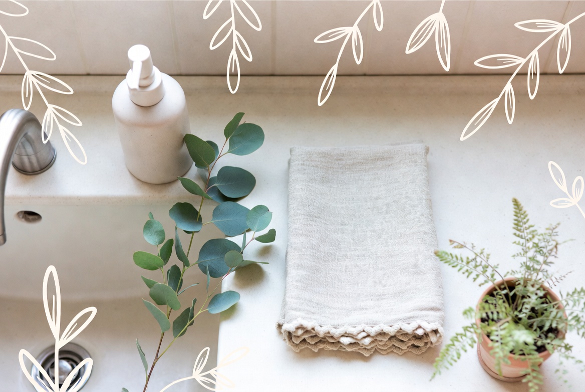 Cozy aesthetic kitchen sink flat lay with linen towel, fresh greenery and natural cleaning elements in soft tones