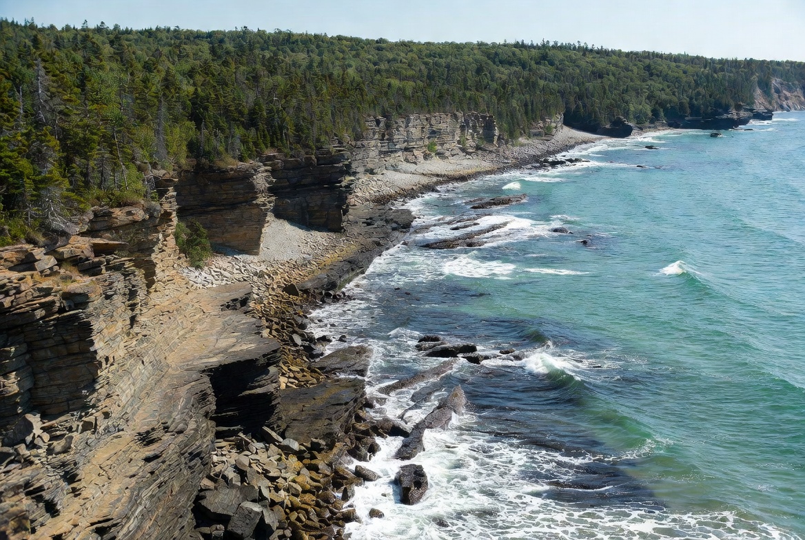 Dramatic coastal cliffs and ocean at Forillon National Park, Gaspé Peninsula Quebec Canada