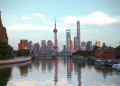 Shanghai Pudong skyline at dusk reflected in the Huangpu River, featuring the iconic Oriental Pearl Tower