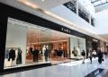 Zara fashion store exterior inside modern Canadian shopping mall with shoppers walking by