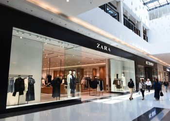 Zara fashion store exterior inside modern Canadian shopping mall with shoppers walking by