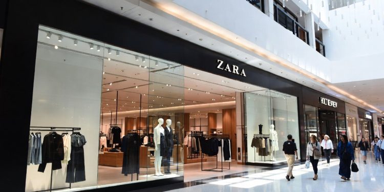 Zara fashion store exterior inside modern Canadian shopping mall with shoppers walking by