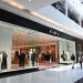 Zara fashion store exterior inside modern Canadian shopping mall with shoppers walking by