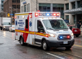 Emergency services ambulance in downtown Toronto responding to a call near Toronto General Hospital